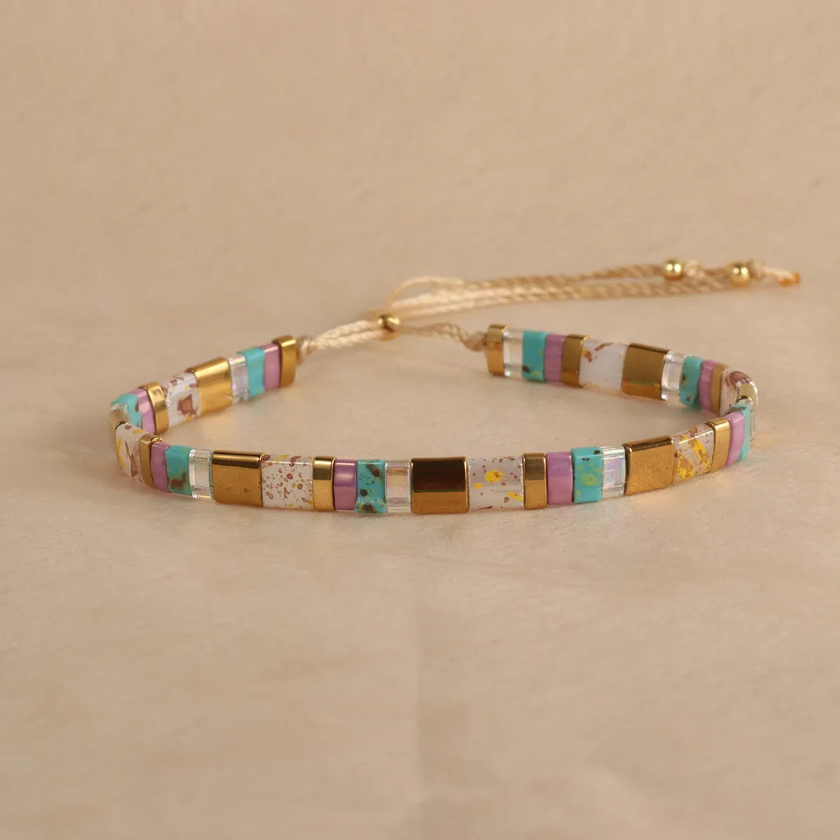 Geometric glass bead bracelet with pull adjustment in five colour options