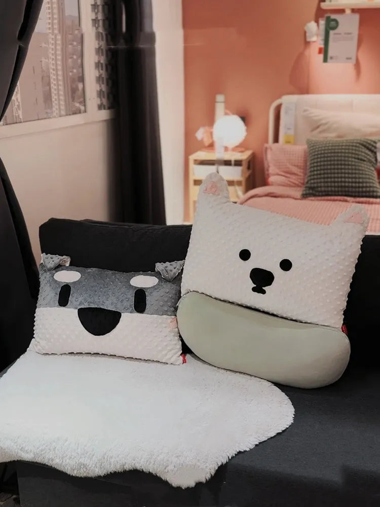 Grey and white decorative dog pillow with Schnauzer print on a sofa