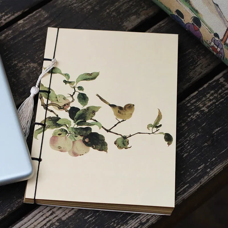 A5 antique thread-bound notebook with embossed cover and decorative tassels
