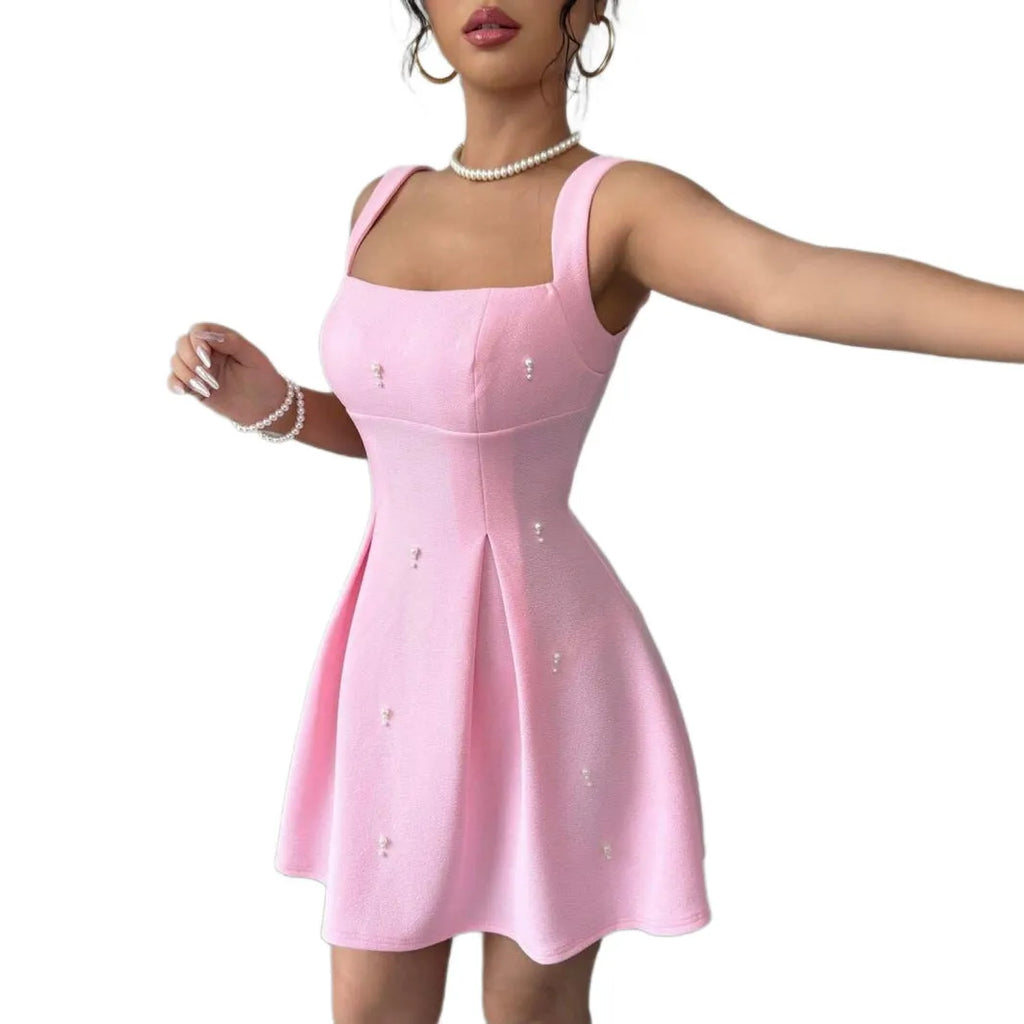 Pink high-waist A-line suspenders dress with short sleeveless skirt in polyester, shown on a model