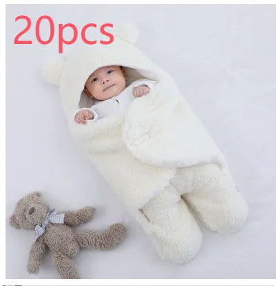 Baby quilted sleeping bag wrapper in a light blue colour showing its quilted pattern and size.