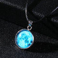 Luminous moon and constellation night sky pendant on an extendable alloy necklace chain.