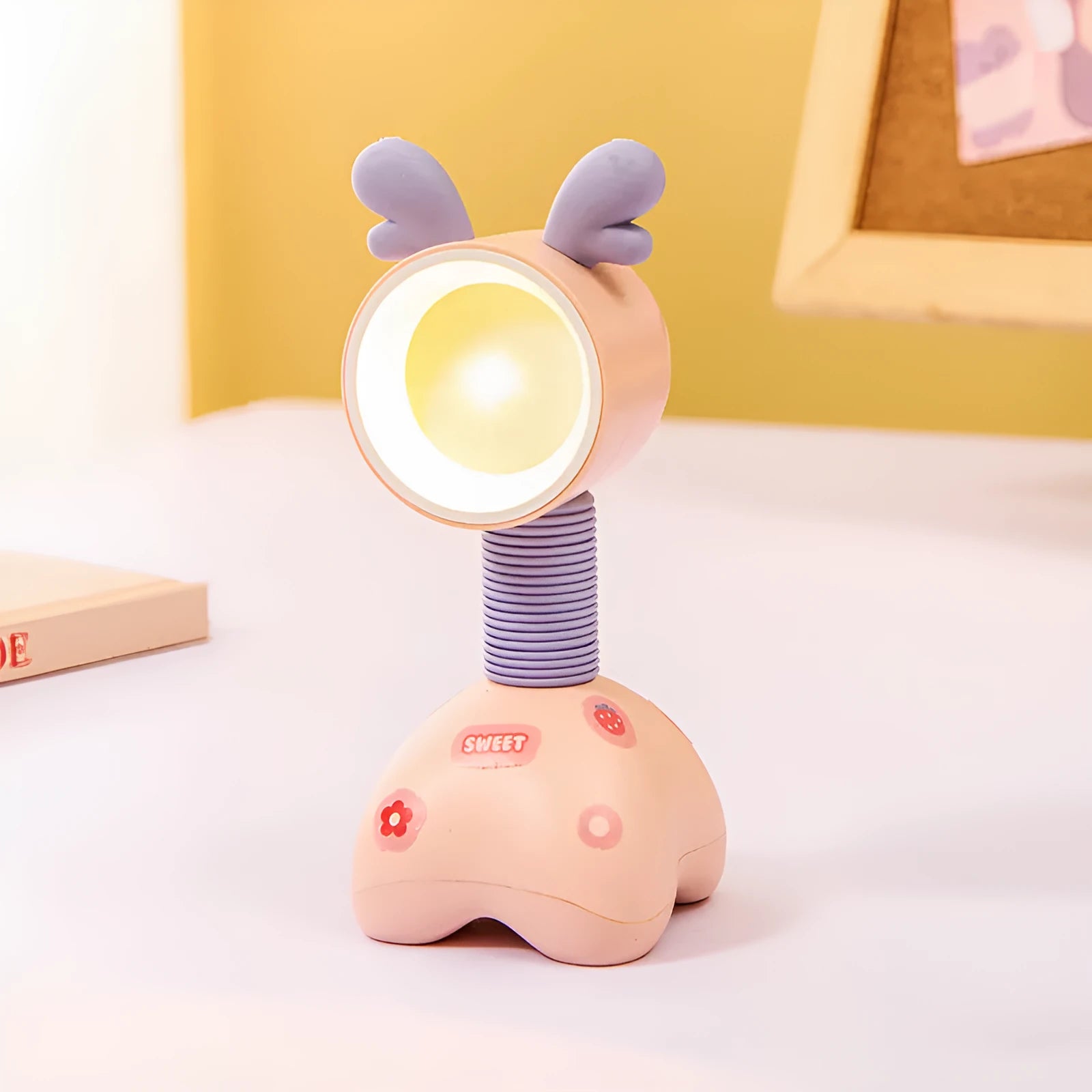 DIY cartoon magnetic small night lamp in assorted animal styles and colours on a desktop.