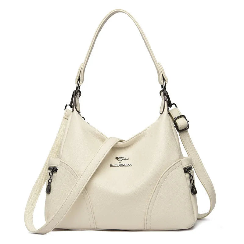 Women's soft PU leather messenger bag in beige with horizontal square shape and lined interior