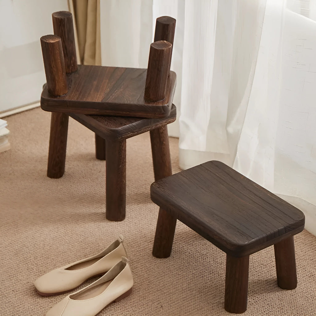 Solid wood household changing stool with a distressed finish and bracket structure.