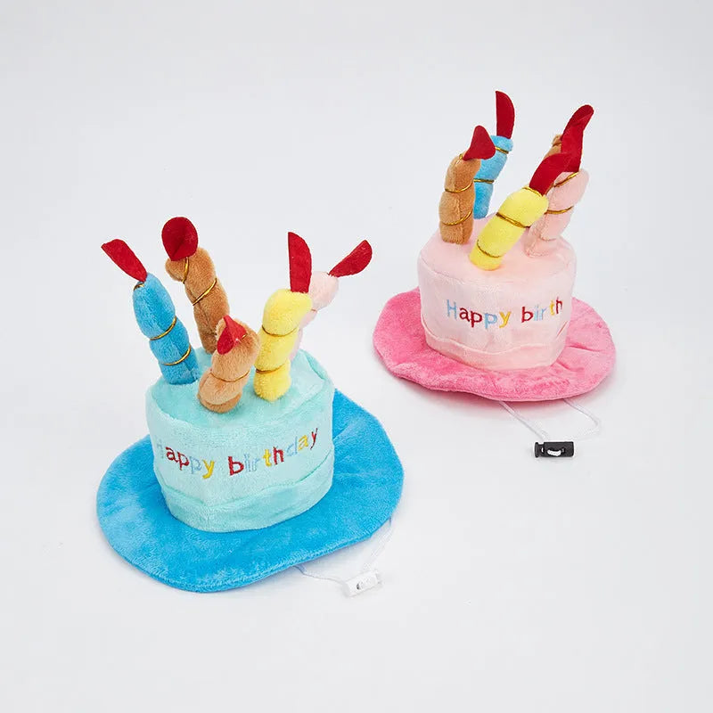 Blue and pink dog birthday hat toy with party whistle, measuring 21cm by 15cm by 6.5cm