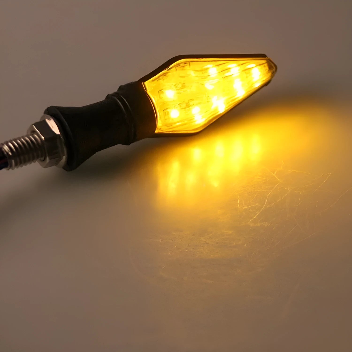 Double-sided luminous LED turn signal for motorcycle with yellow and blue light options, plastic housing, 12V