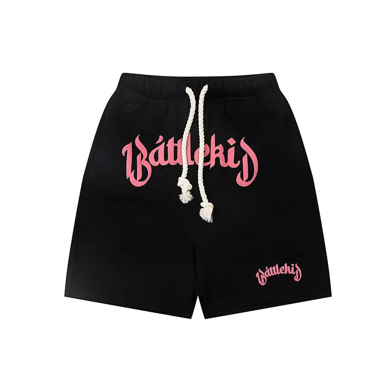 Men's loose grey cotton blend hip hop shorts with a cropped, street-style design on a neutral background.