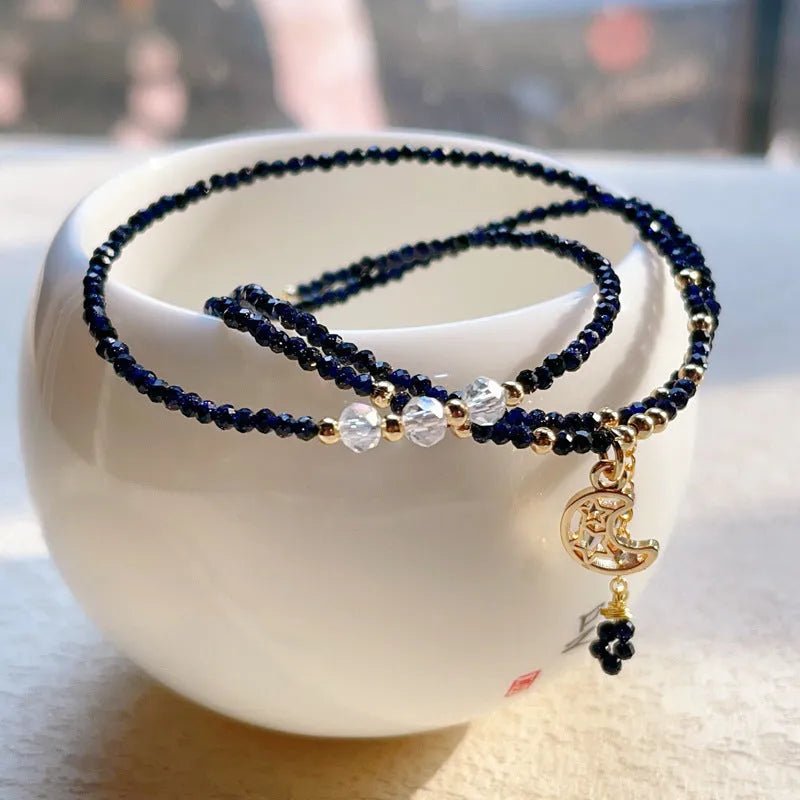 Women's three-ring layered bracelet with blue sand stone beads and gold-toned metal components