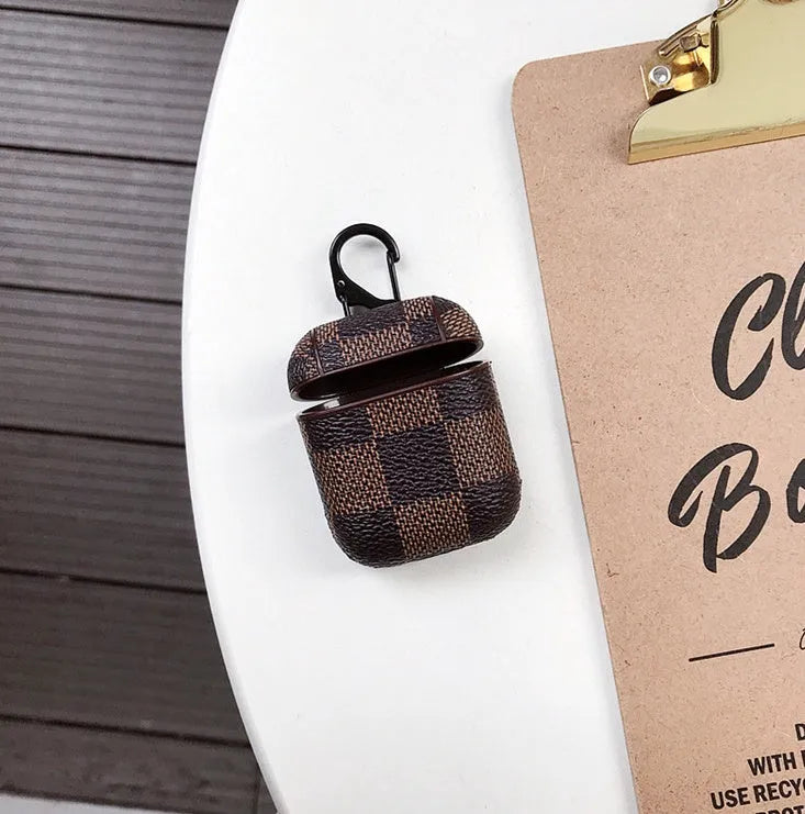 Black lattice hard shell case for iPhone XS Max and AirPods with anti-lost hook attached.