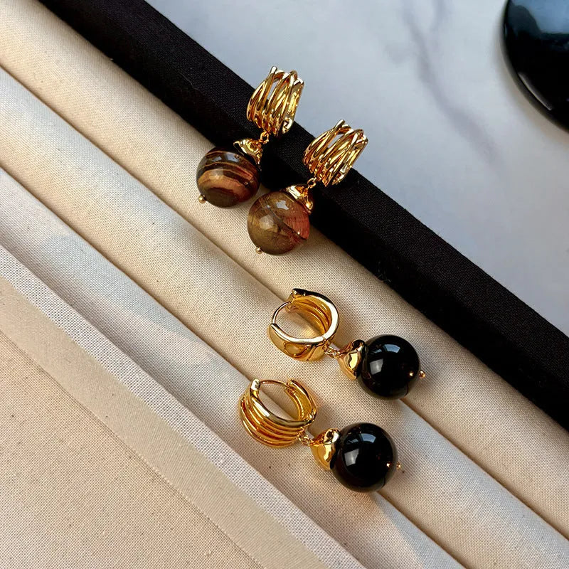 A pair of round geometric tigereye gemstone earrings with real gold plating in a French retro style.