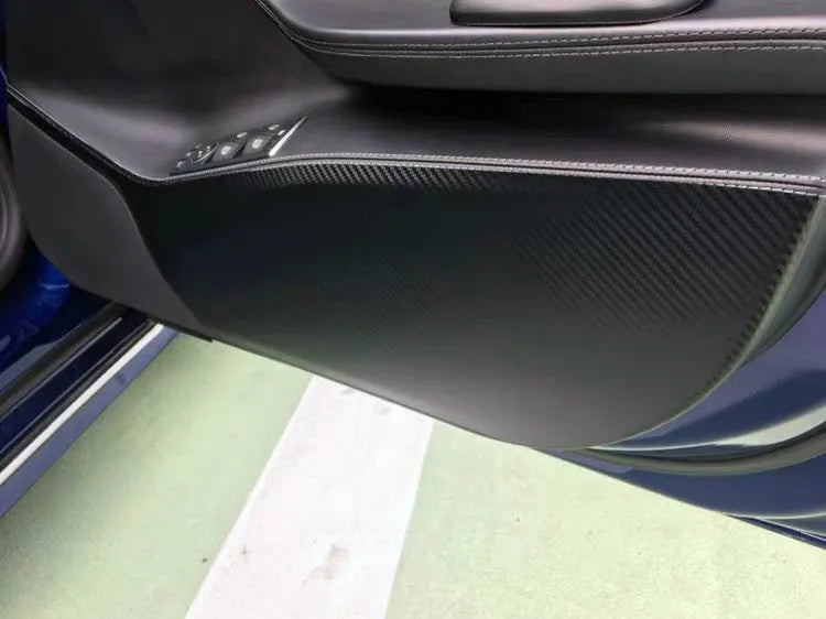 Carbon fibre protective film for Tesla Model S car door interior panels, four-piece pack.
