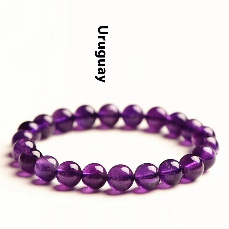 Natural amethyst Uruguay bracelet with scattered polished beads on a single ring.