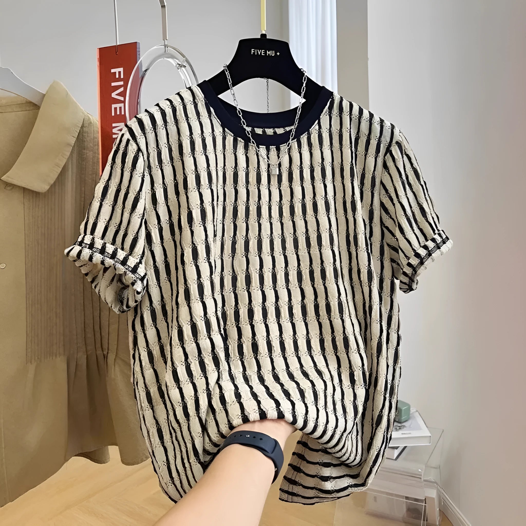 Black striped men's loose casual short sleeve pullover shirt made from linen and silk blend.
