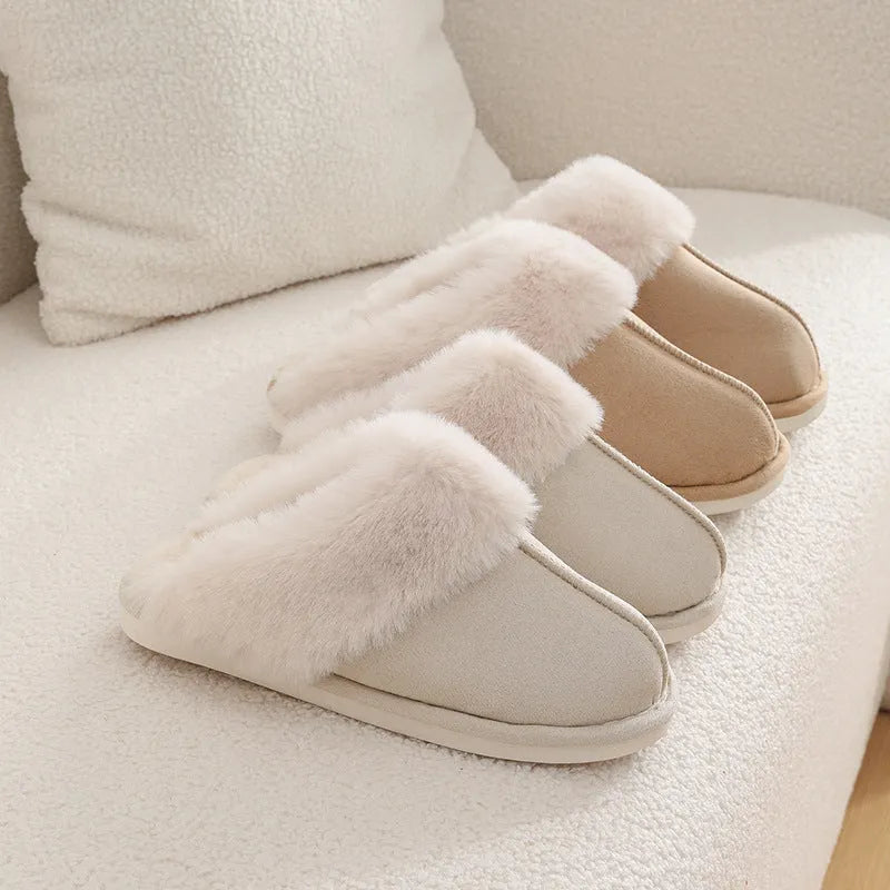 A pair of brown plush winter slippers with a round toe, flat heel, and non-slip PVC sole.
