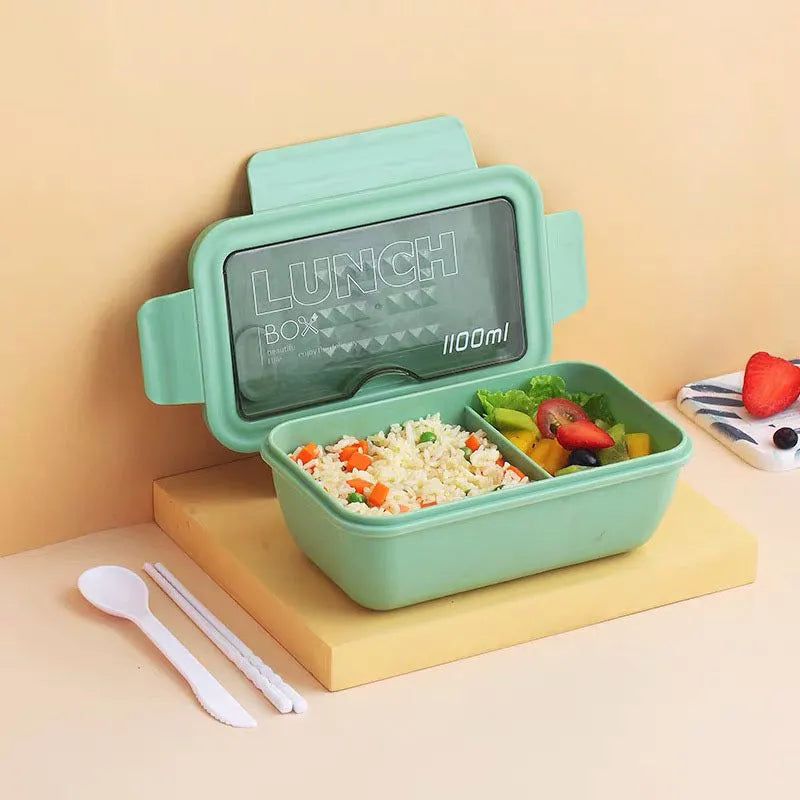 Green Nordic style partitioned lunch box with four food compartments