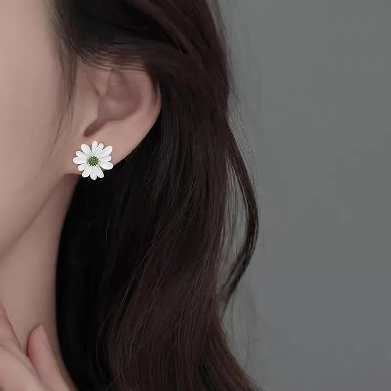 A pair of alloy cartoon flower stud earrings in blue and orange two-tone colours.