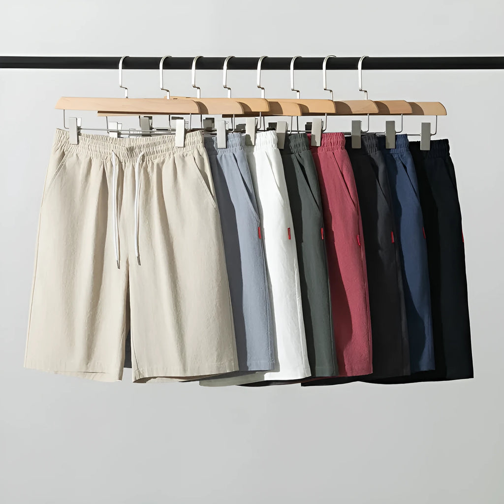 A pair of solid colour cotton linen cropped pants with a drawstring waist, shown in Army Green.