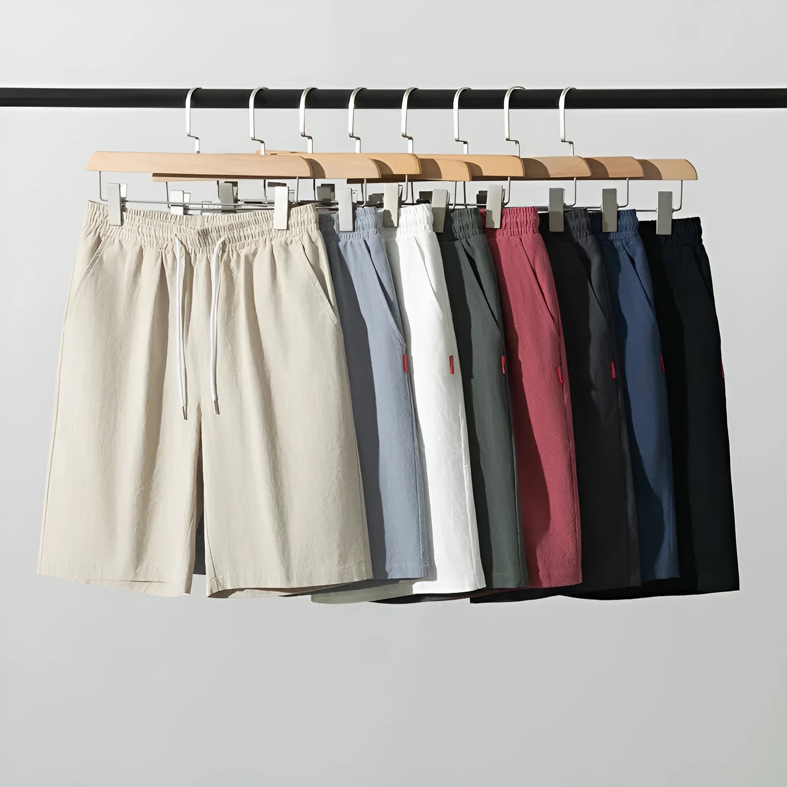 A pair of solid colour cotton linen cropped pants with a drawstring waist, shown in Army Green.