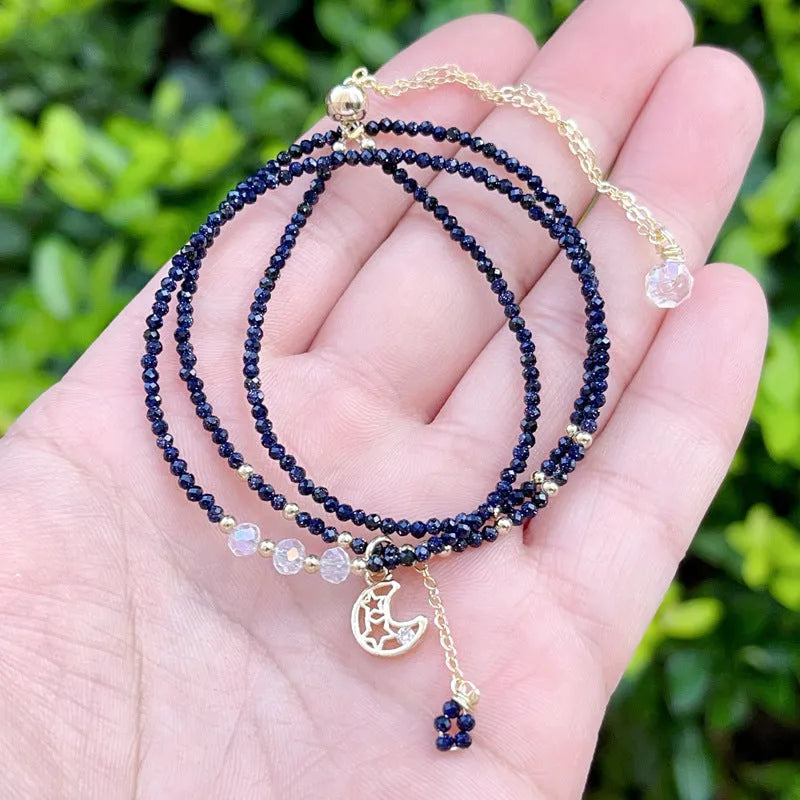 Women's three-ring layered bracelet with blue sand stone beads and gold-toned metal components