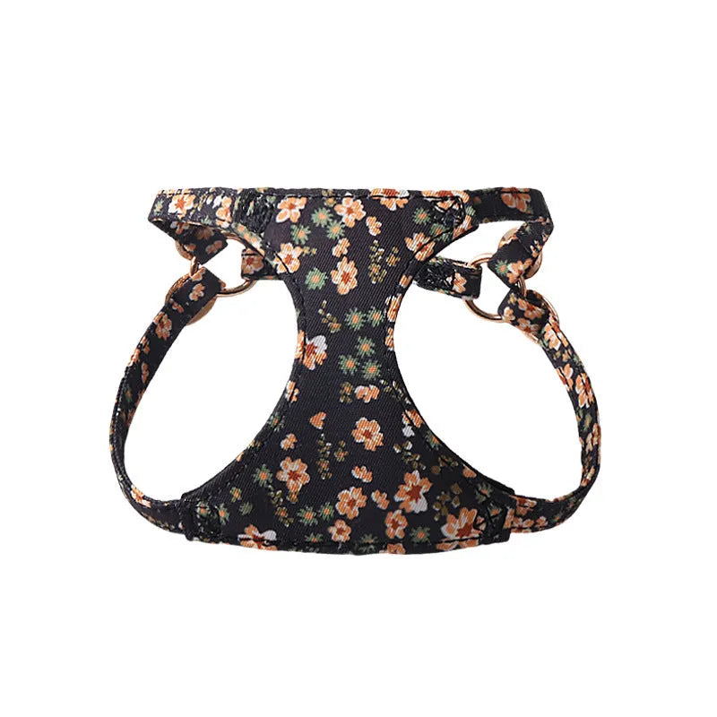 Cloth dog harness and leash set shown in various colours including a floral print, for small dogs.