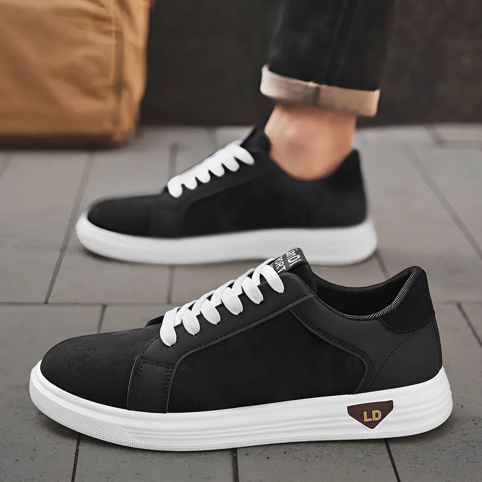 Men's black snake pattern PU leather sneakers with round toe and flat rubber sole.