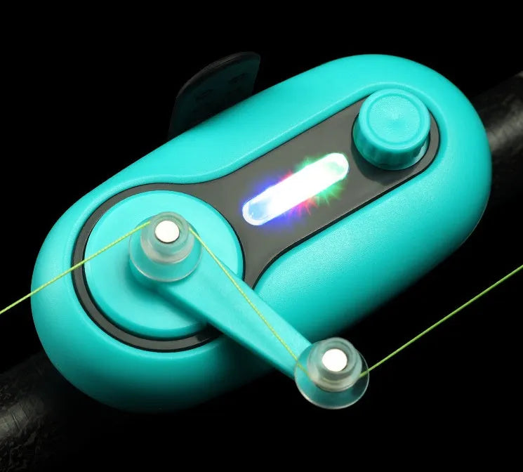Blue electronic fishing bite alarm with LED light and buzzer attached to a fishing rod