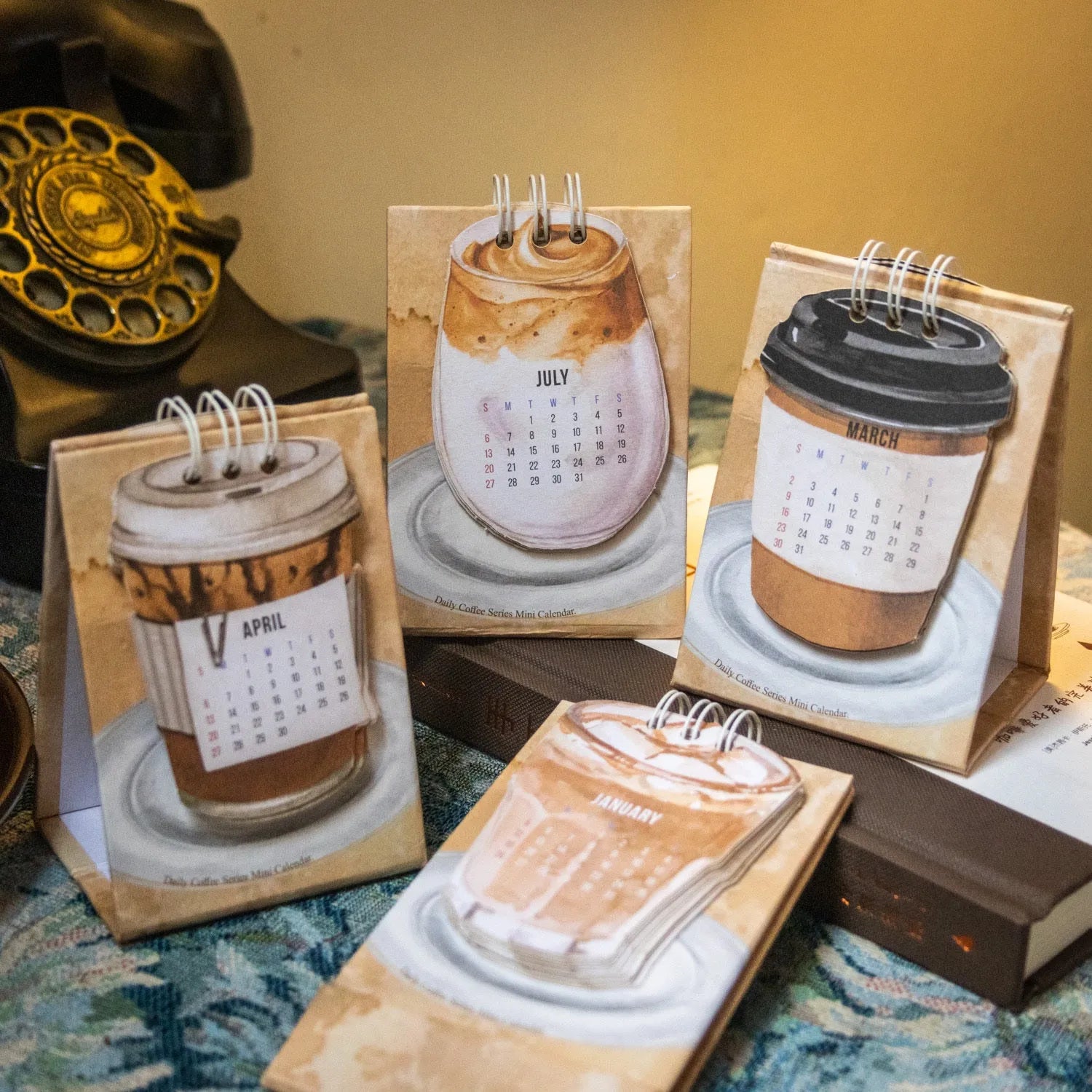 2025 mini desk calendar set showing ten different paper designs including Coffee Time and Life Is Not Easy.