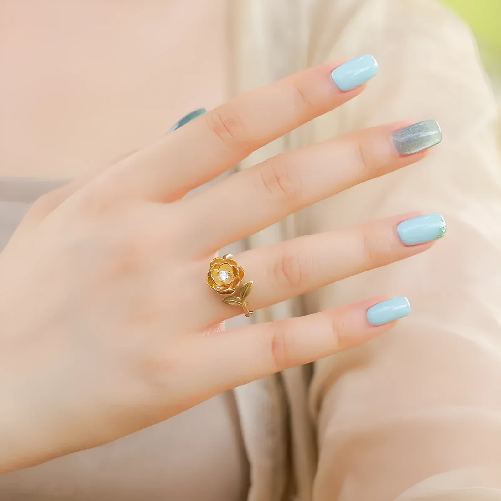 Women's 925 silver adjustable flower ring with gold electroplated finish on index finger