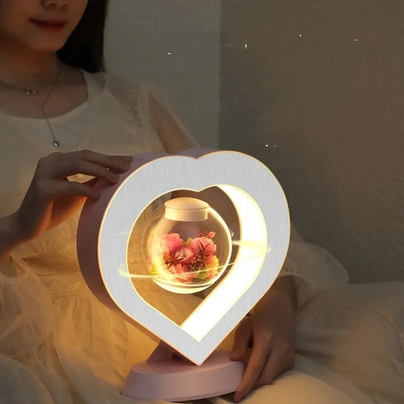 Magnetic levitation heart night light with pink eternal rose on a triangular stand