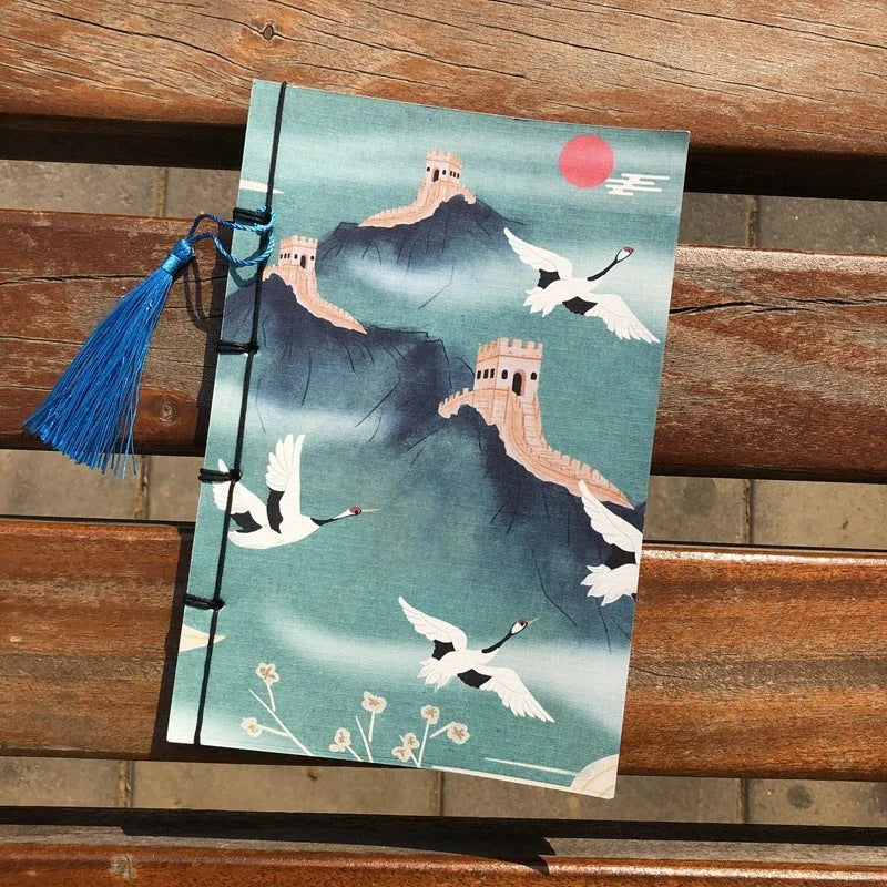 A5 antique thread-bound notebook with embossed cover and decorative tassels
