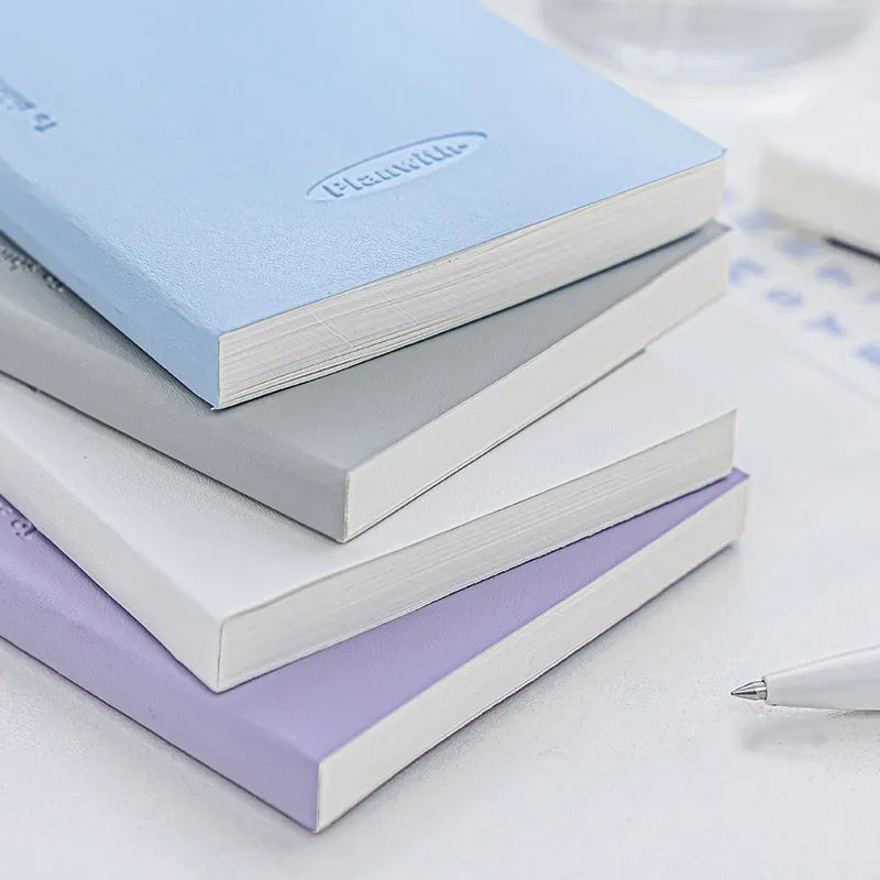 Embossed simple visual daily meter notebook in blue, showing its cover and page layout.