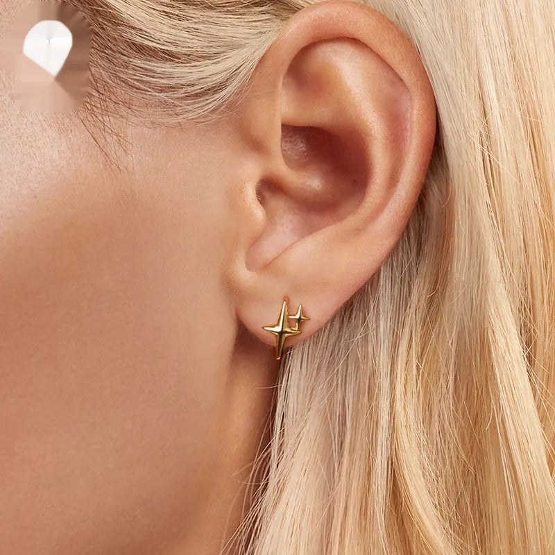 Minimalist sterling silver star ear clips with XINGX elements and oxidation treatment