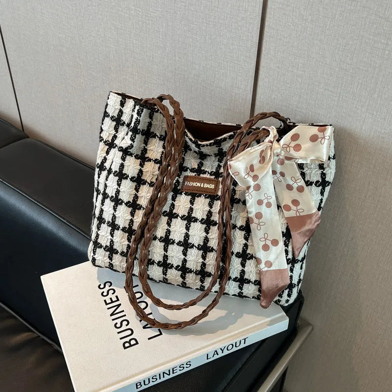 Black wool blend horizontal square shoulder bag with internal compartments for commuting and shopping