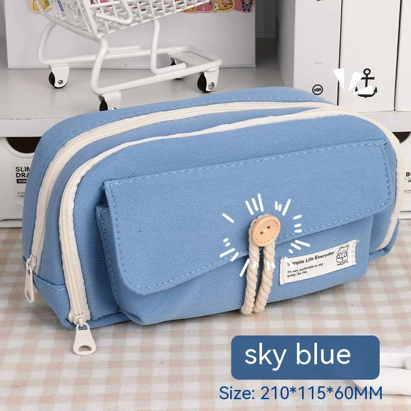 Green Korean-style canvas pencil case open, showing large capacity for pens and stationery.