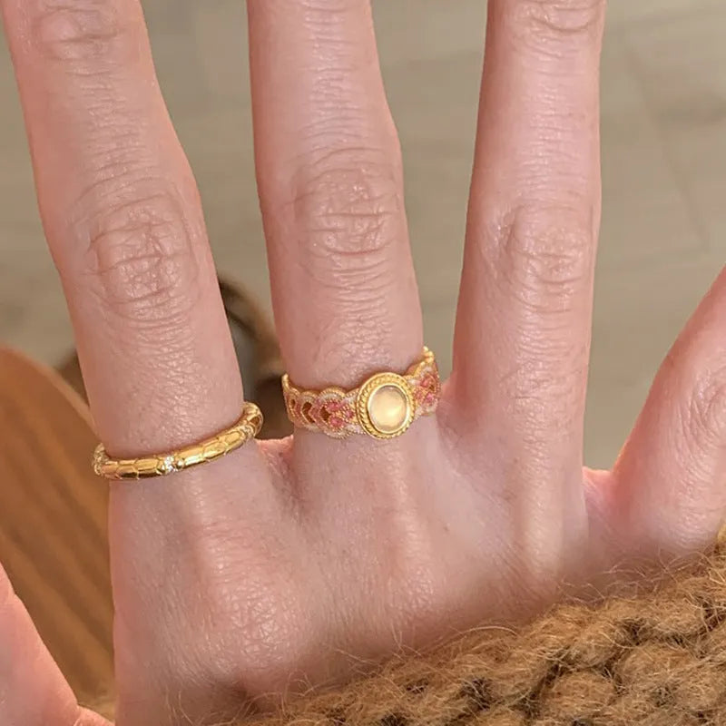 Pink crystal enamel geometric open ring on gold-plated copper band for women.