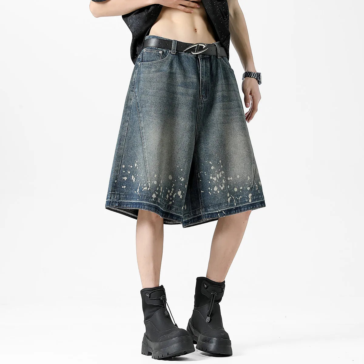 Retro blue denim shorts with distressed rip details and splash ink patterns, straight leg cut