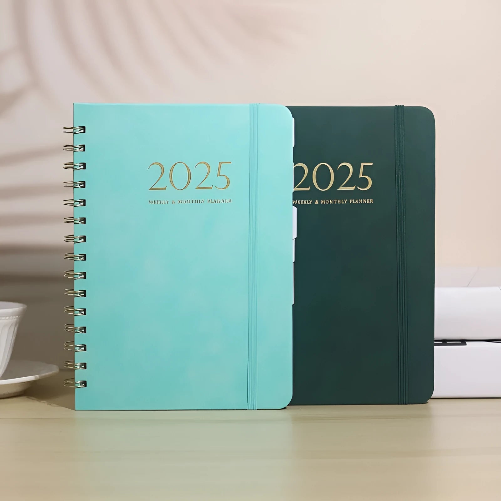 A5 size PU leather notebook with metal coil binding in various colour options showing year-specific cover designs