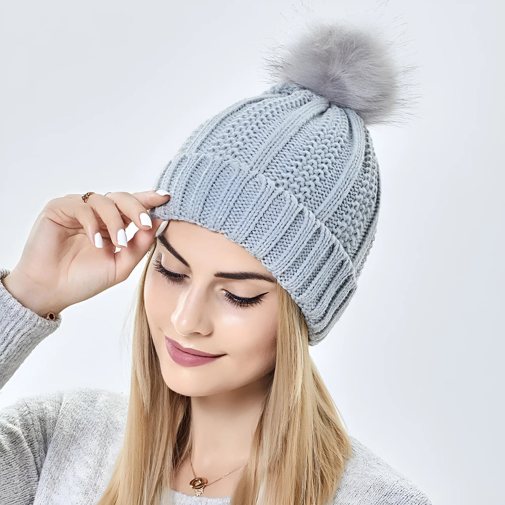 Wool knit beanie hat with satin lining and faux fur pom pom in multiple colours