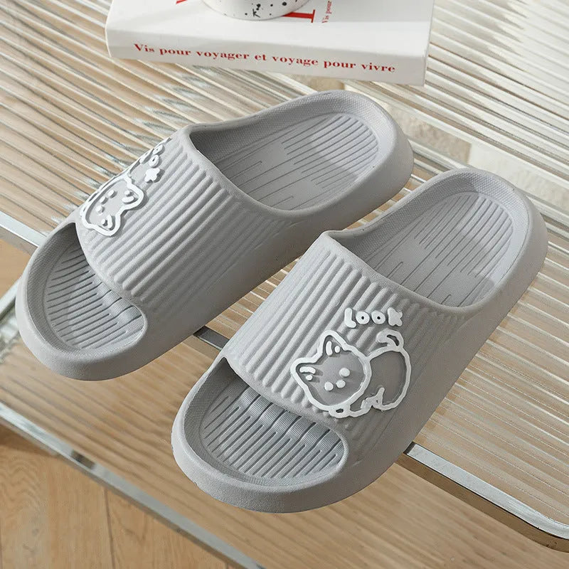 Women's green cat slippers with thick platform sole and flip-flop design.