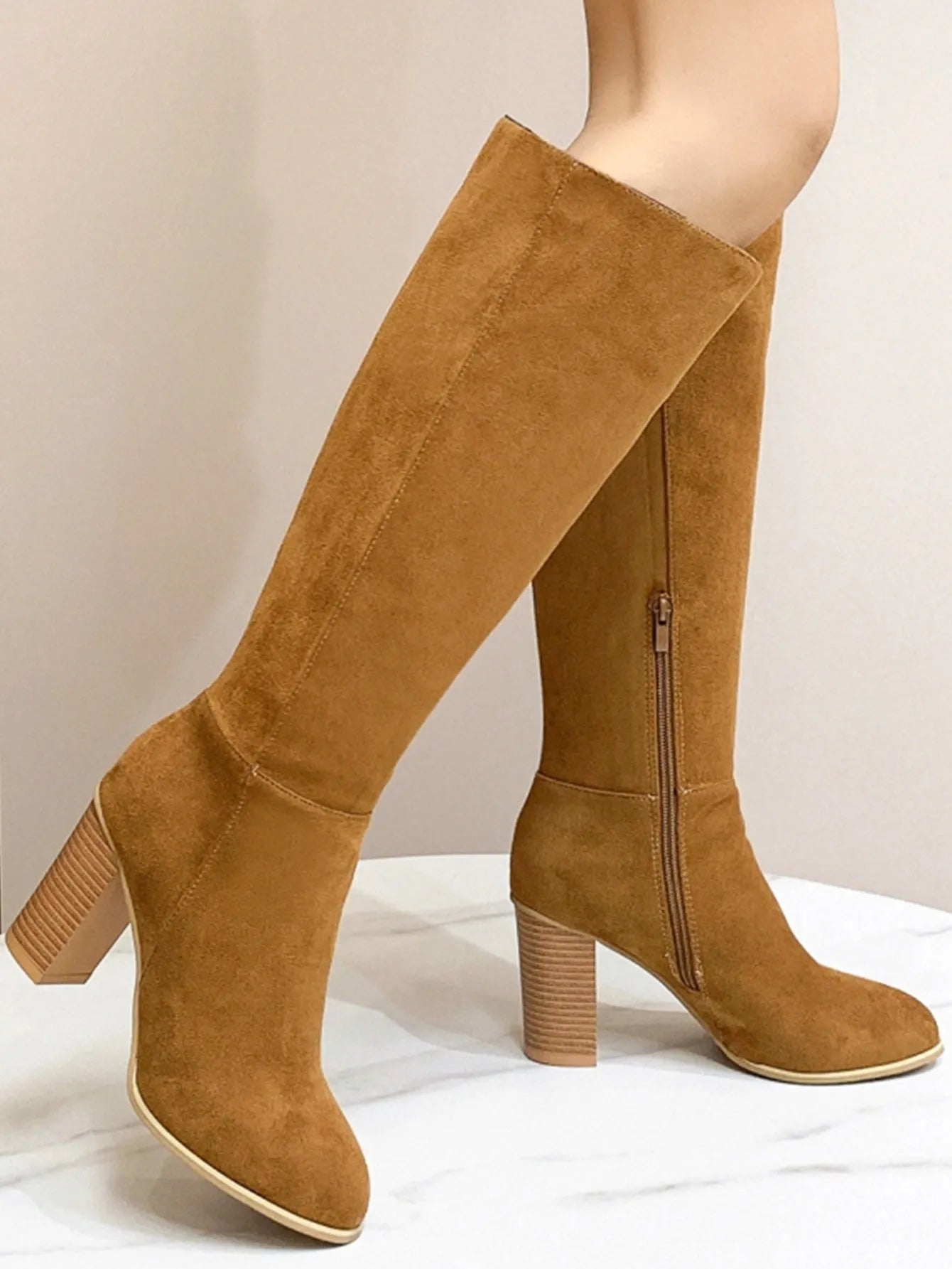 Women's square toe high heel boots in black or dark brown, showing artificial PU upper construction