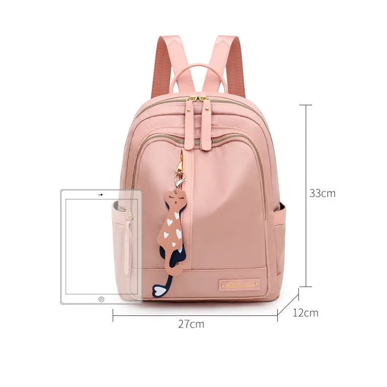 Women's black casual nylon backpack with double shoulder straps showing interior organisation compartments