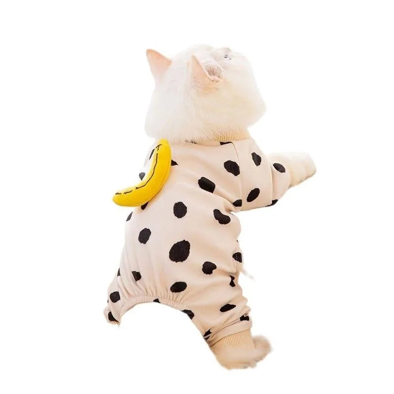 Cute kitty wearing an anti-lint Dralon pet coat in white polka dot banana design