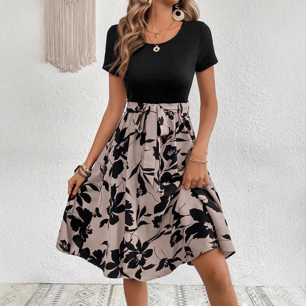 Women's khaki A-line casual dress with shoulder strap detail on a hanger.