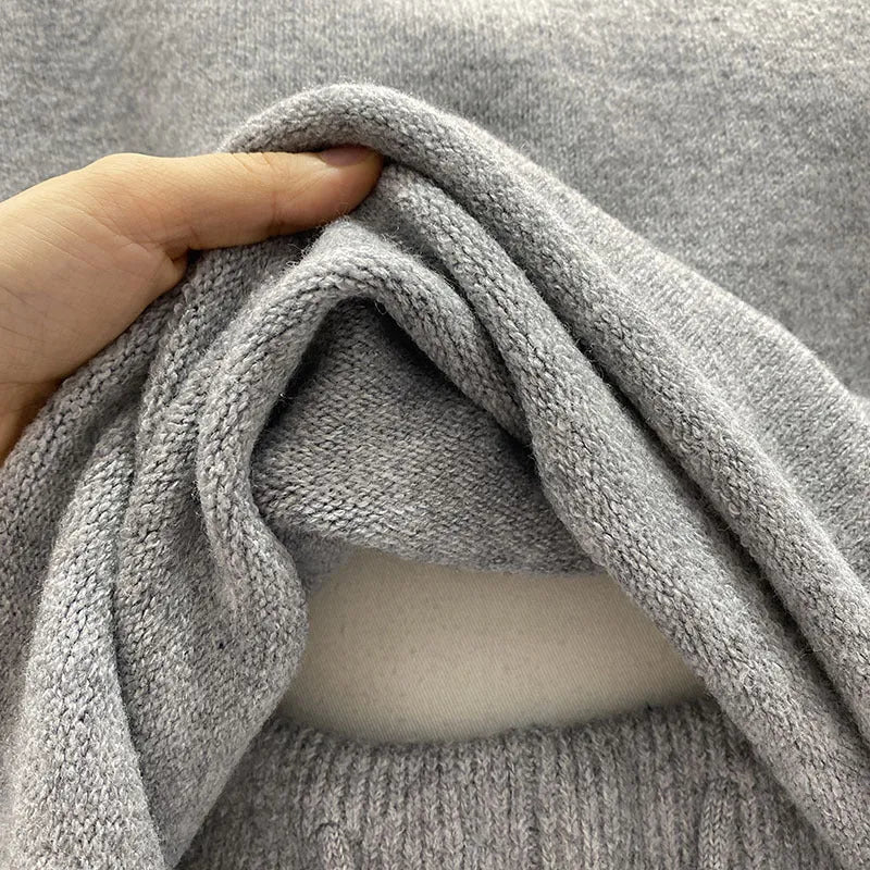 Women's loose-fitting long sleeve sweater and wide-leg shorts two-piece set in a neutral colour.