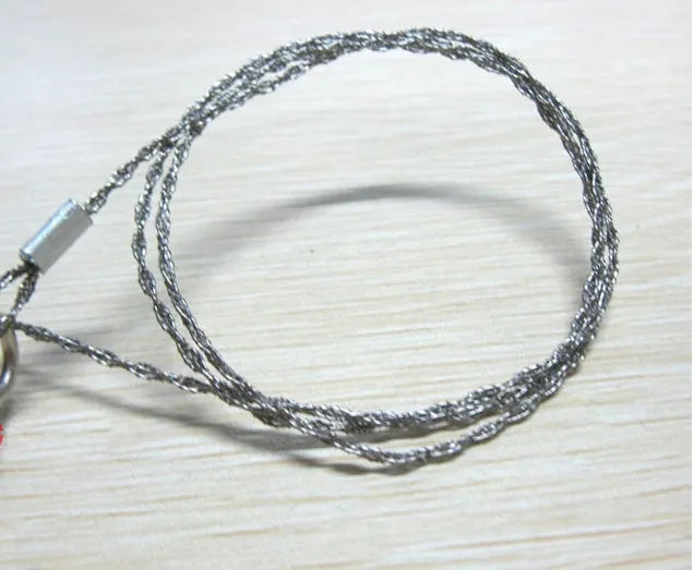Multifunctional survival wire saw with stainless steel cutting wire and metal pull rings extended to full length