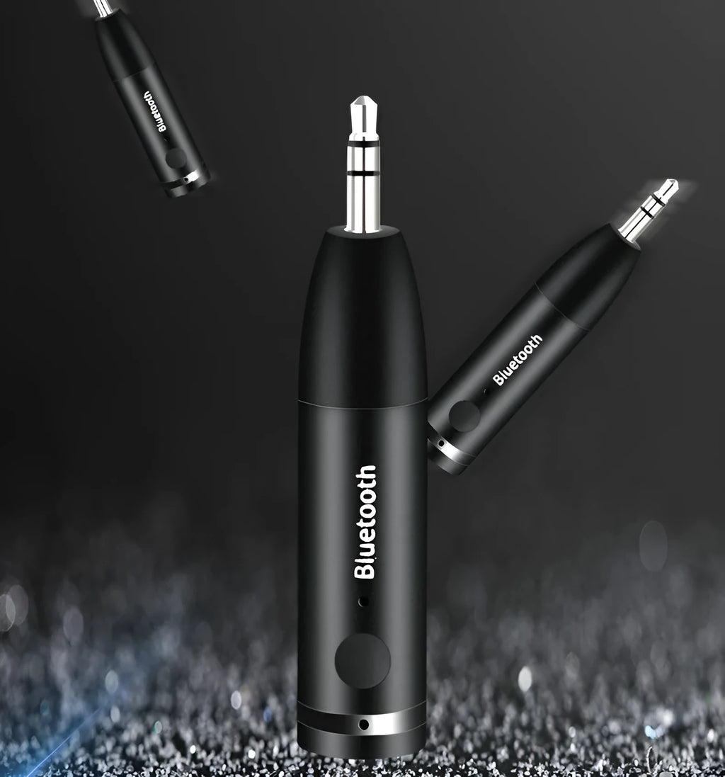 Black AUX Bluetooth 5.0 audio receiver for car stereo with USB cable.
