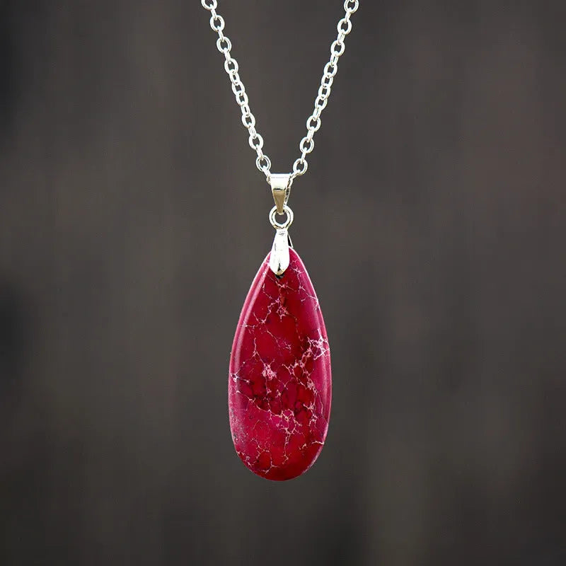 Emperor Stone jade pendant necklace with 18K gold plating, showing heart-shaped design in red silver finish.