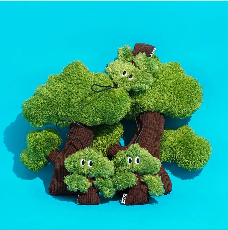 Green pine tree shaped fabric cat toy bag with hanging loop.
