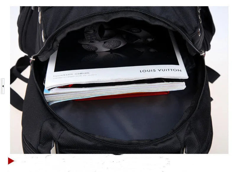 Black travel outdoor backpack with polyester waterproof finish, hard handle, metal details, and shoulder pad on a white background